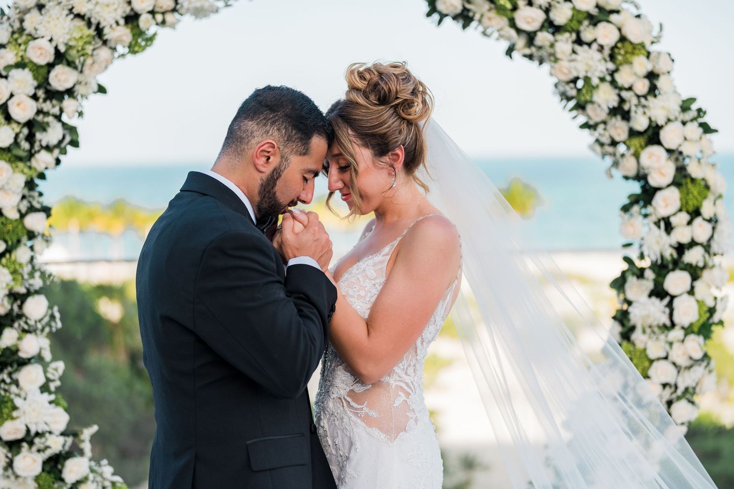 Riu Palace Costa Mujeres Wedding - bride and groom holding hands