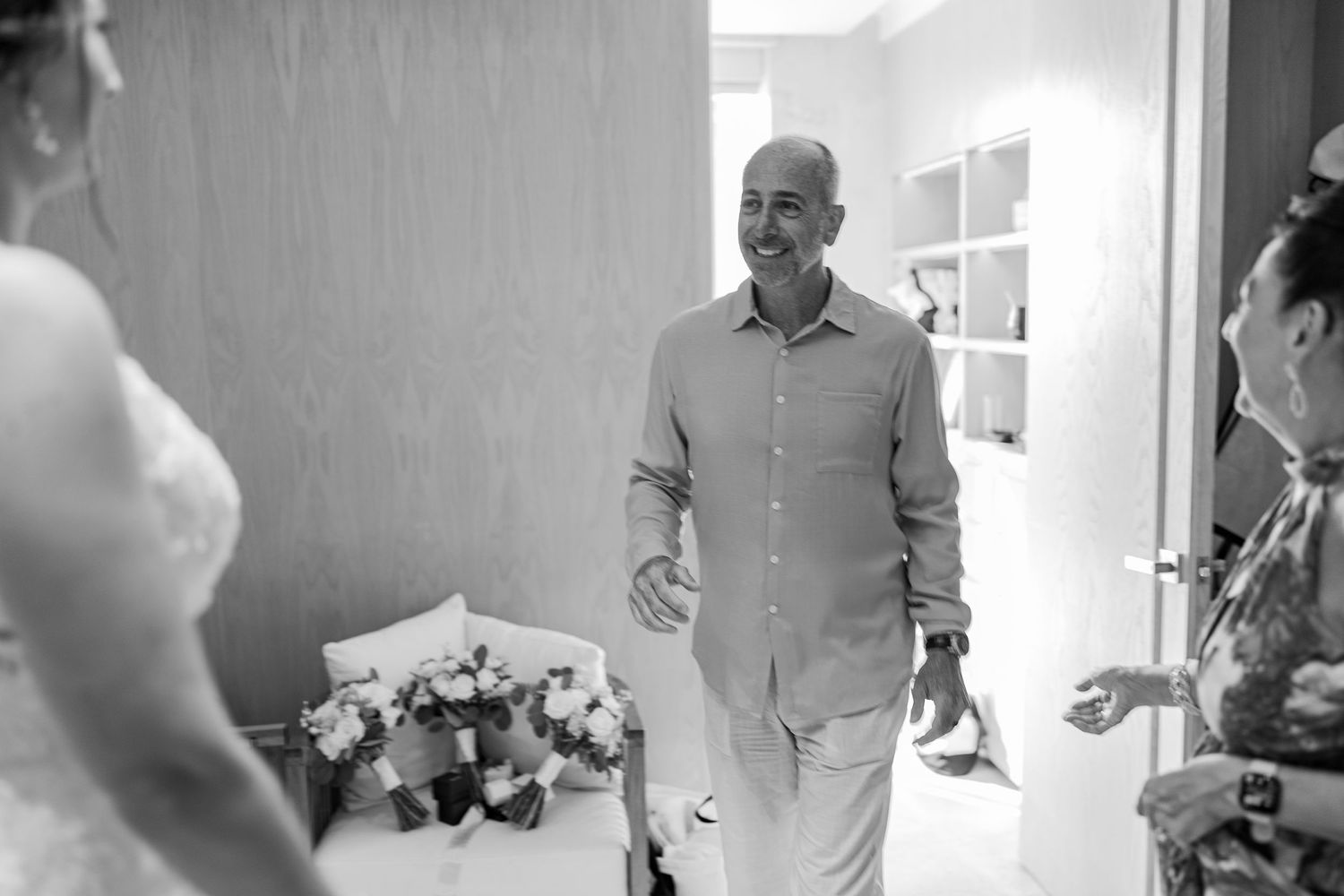 Father of bride emotional first look reaction in black and white wedding photo.