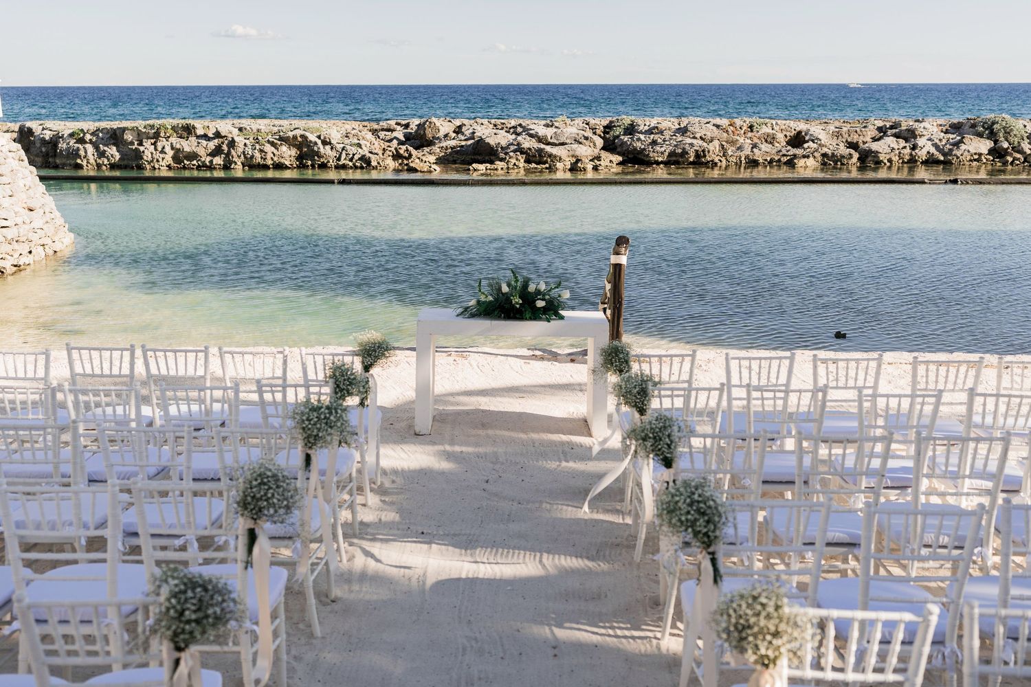 Elegant outdoor wedding ceremony setup at Hard Rock Riviera Maya