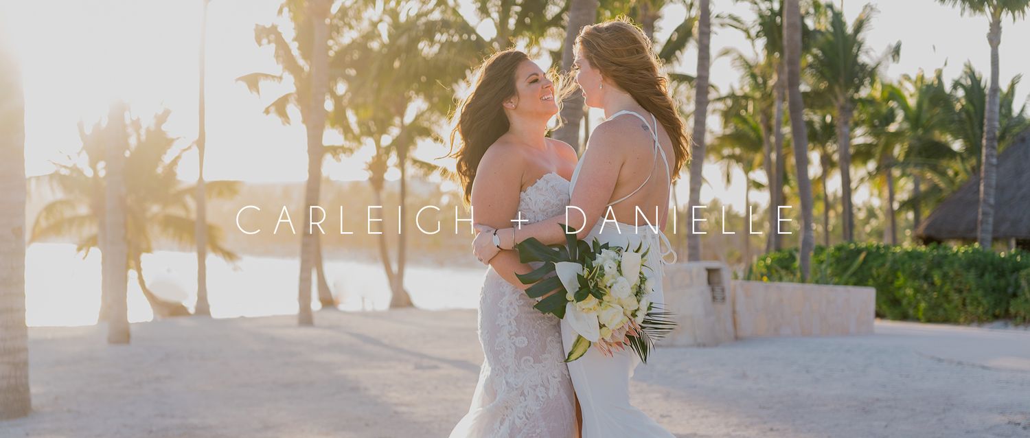 Same-sex wedding video title card featuring brides Carleigh and Danielle sharing a kiss at sunset.