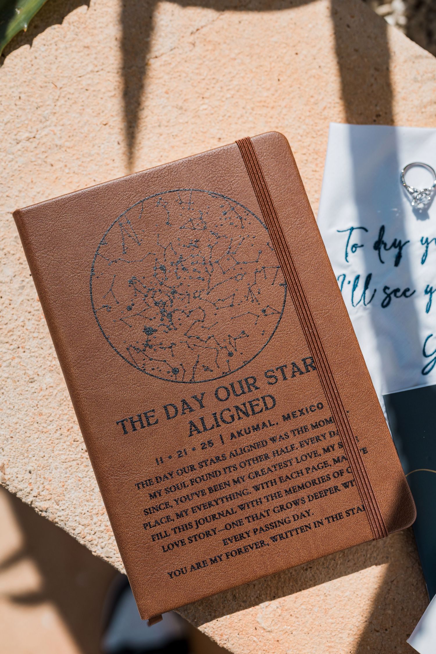 Brown leather journal engraved with 