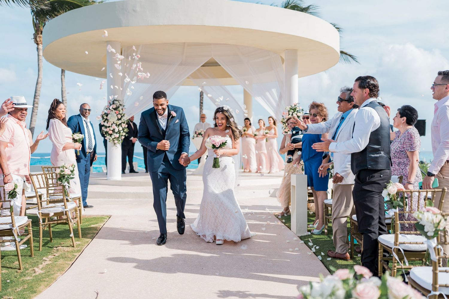 cancun wedding  photographer and filmmaker - wedding ceremony exit at Hyatt Ziva cancun