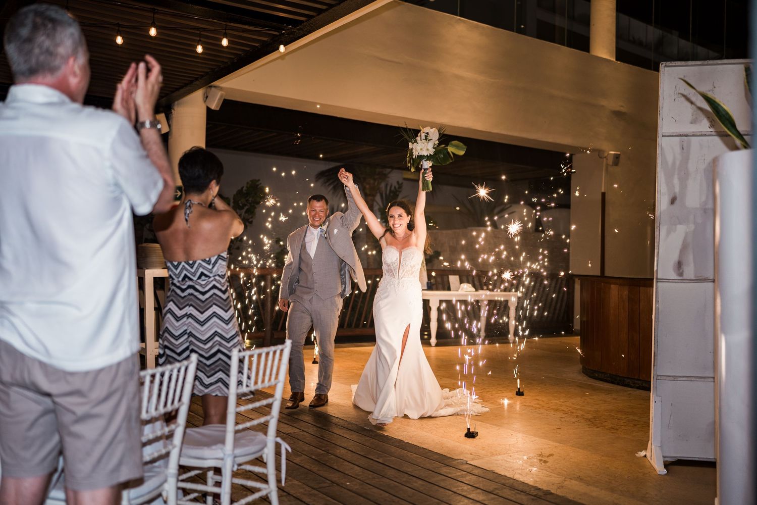 Bride and groom make grand entrance at outdoor wedding reception at grand palladium costa mujeres