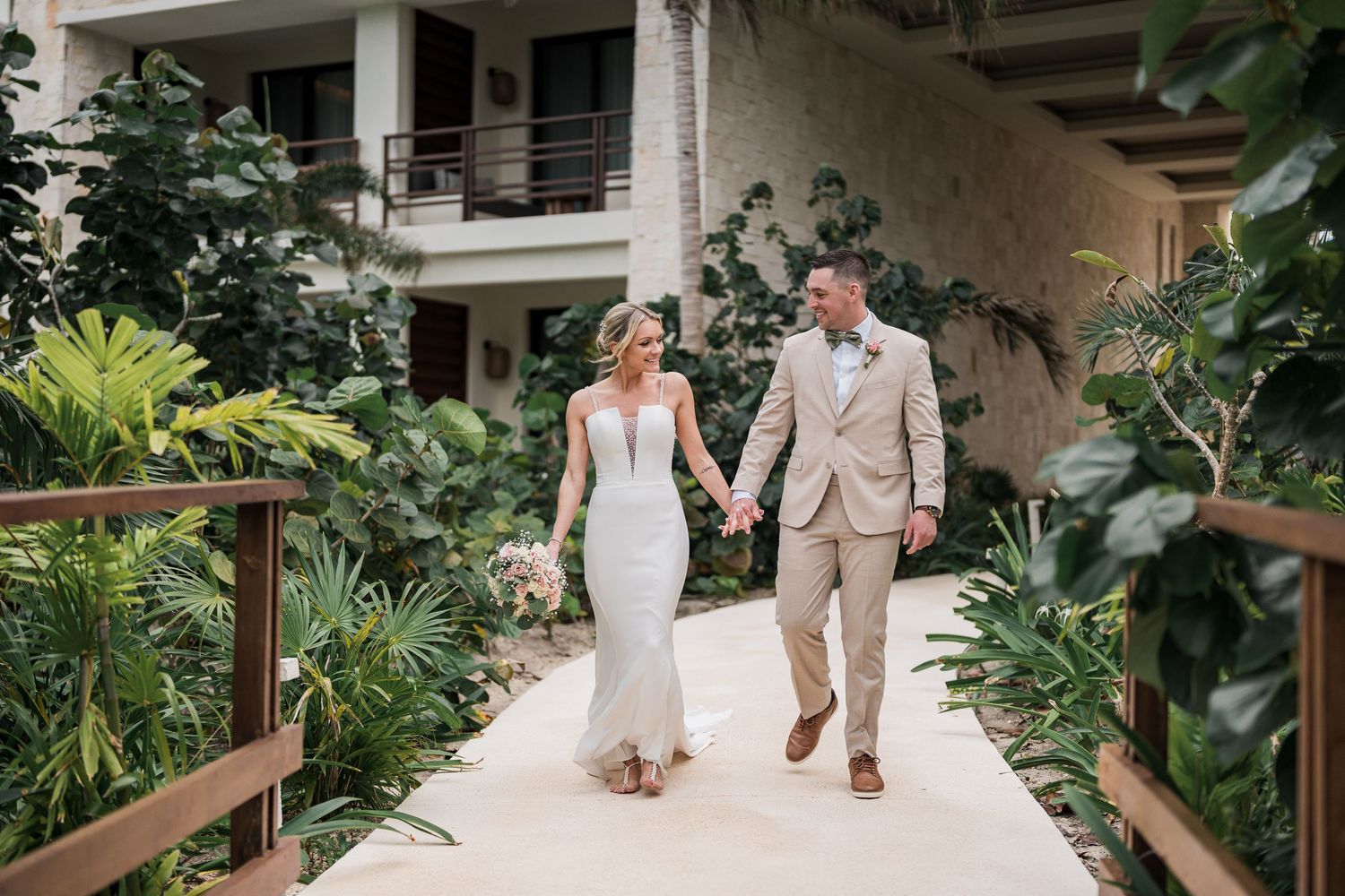 Mexico destination wedding photographer and Filmmaker - couple walking during bride and groom portraits