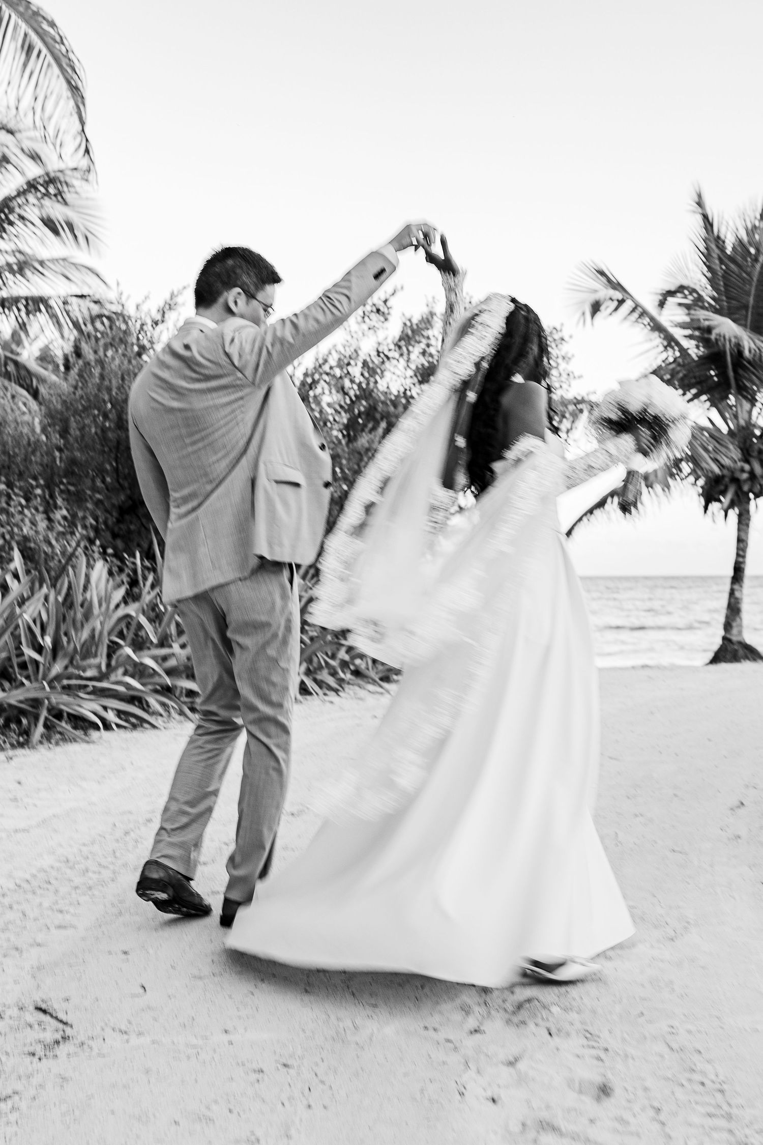 bride and groom black and white portrait at the beach
