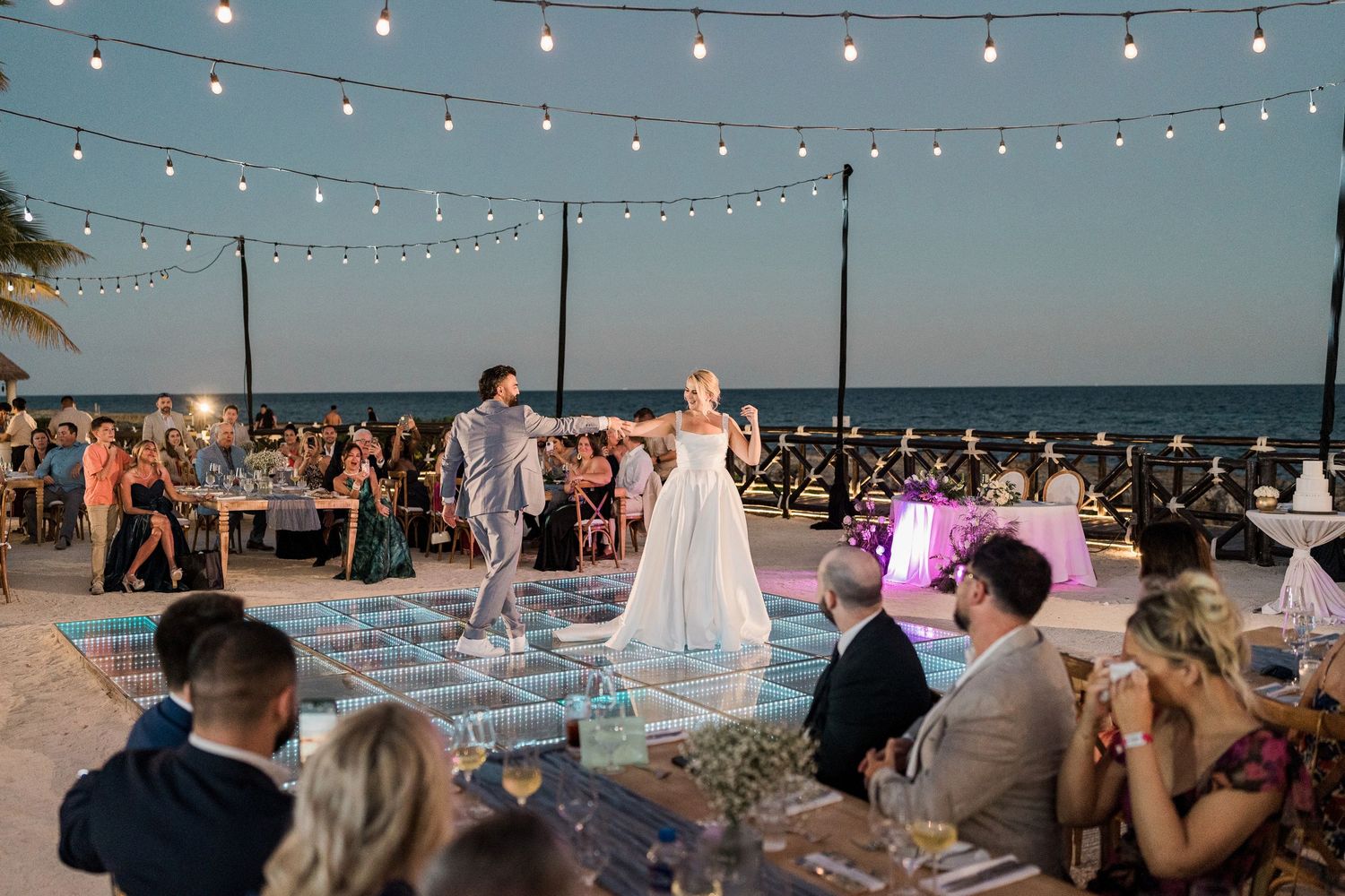 Couple shares first dance on outdoor dance floor at Hard Rock Riviera Maya