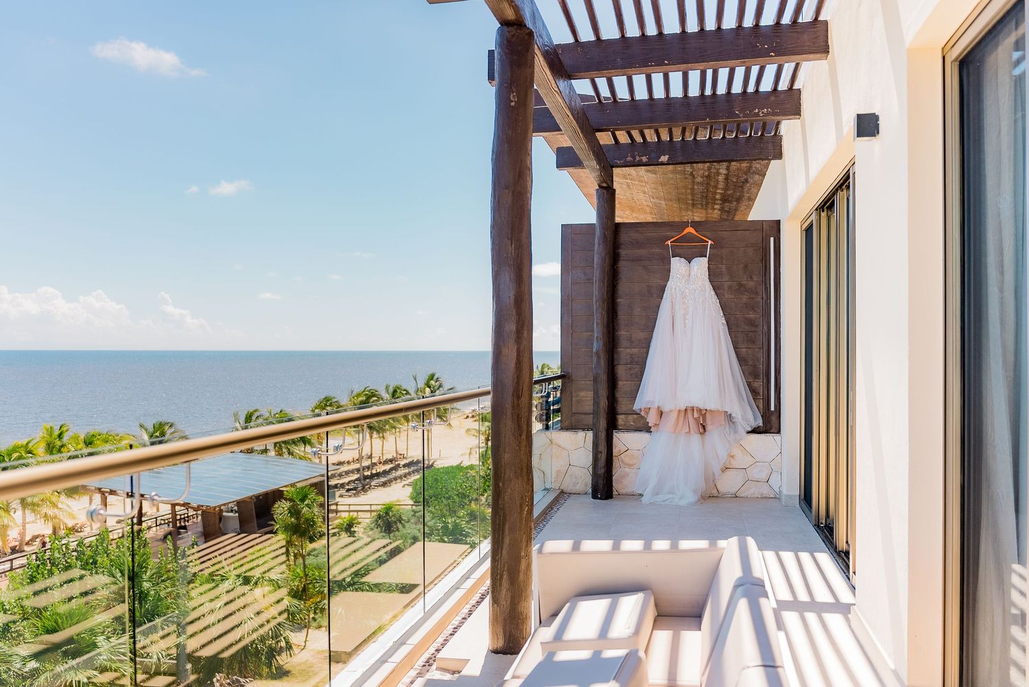 Royalton Riviera Cancun Wedding wedding dress hanged on balcony