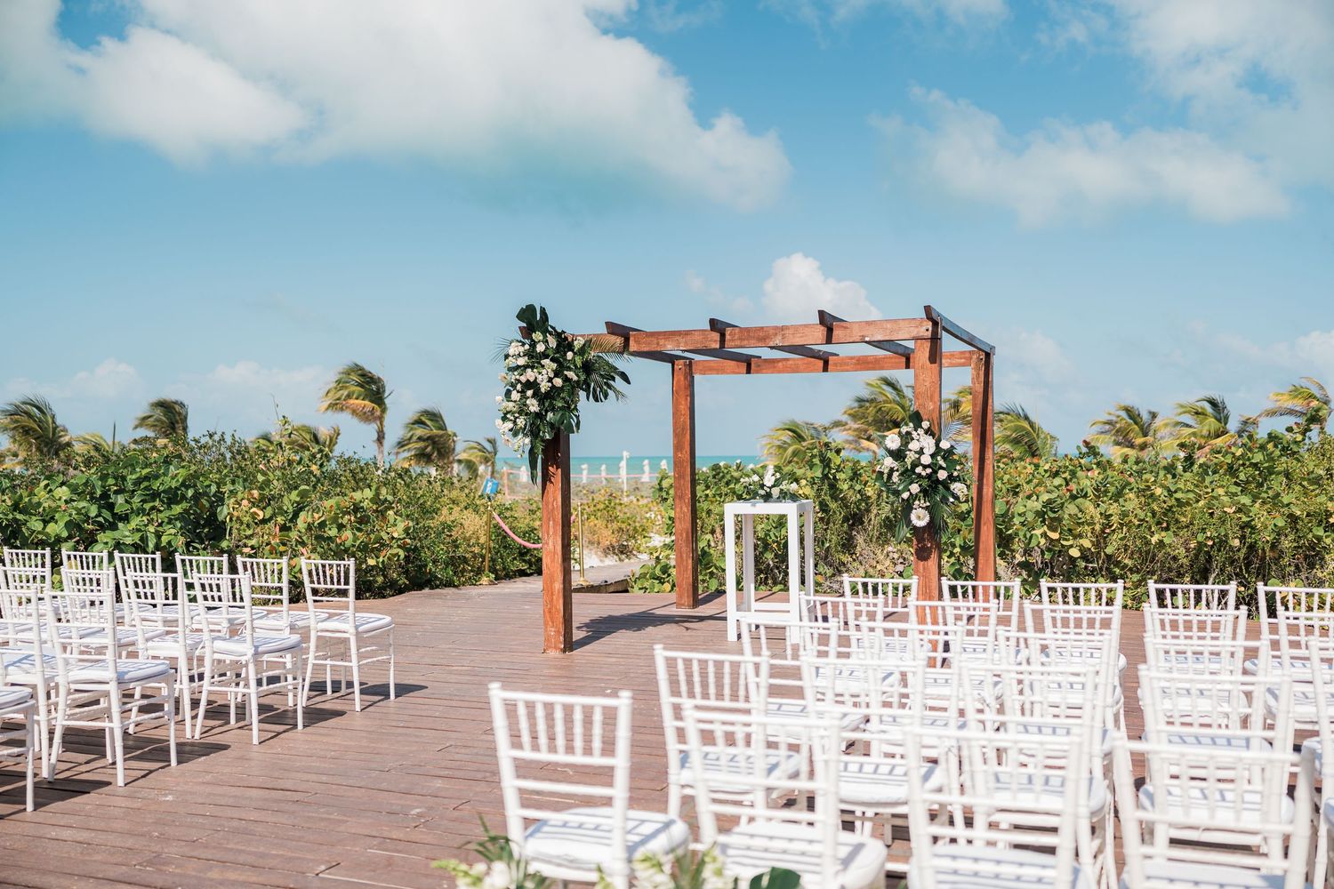 Outdoor beach wedding ceremony setup at grand palladium costa mujeres wedding