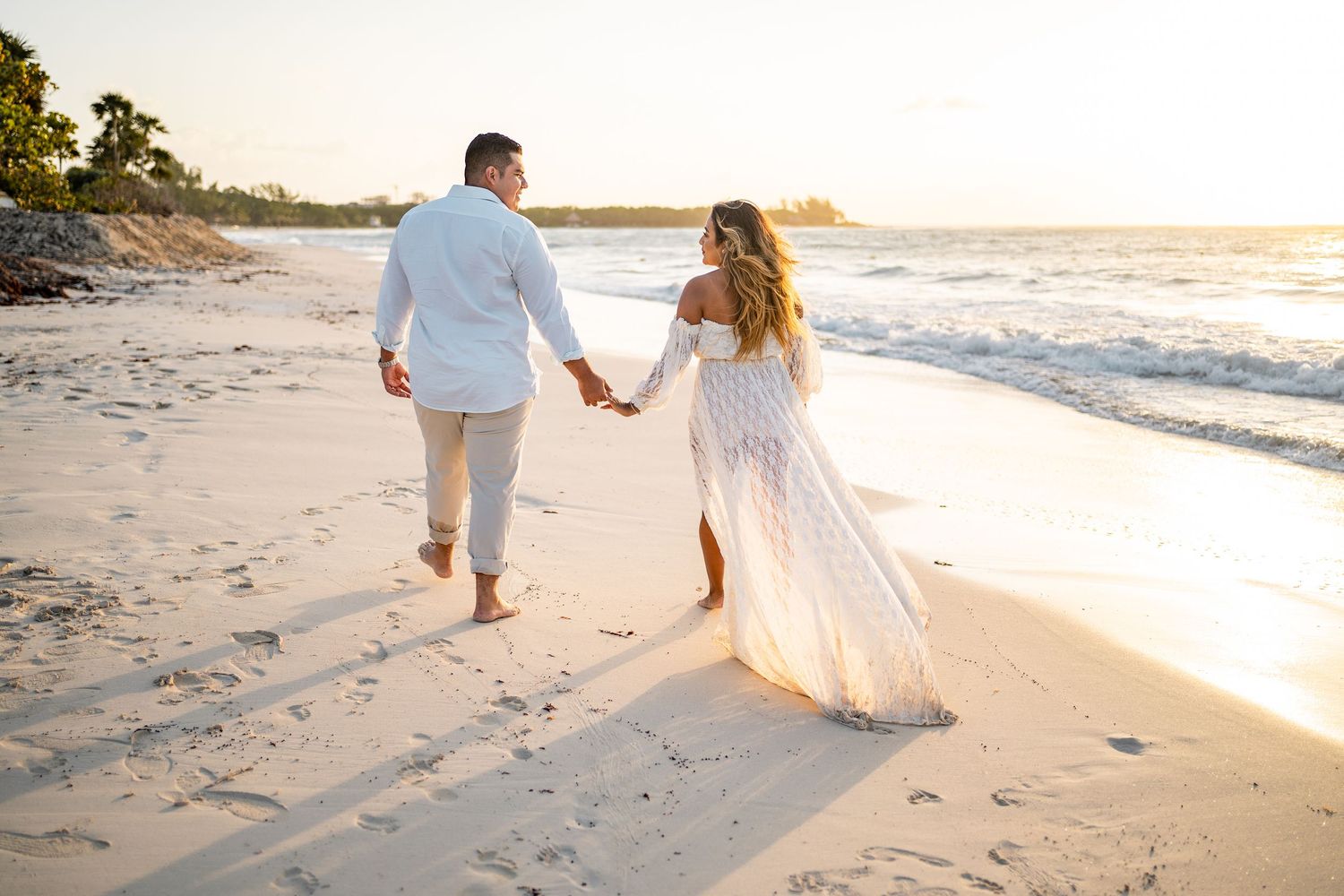 Couple holding hands and walking during golden hour beach session in Playa del Carmen — Luis Tovilla
