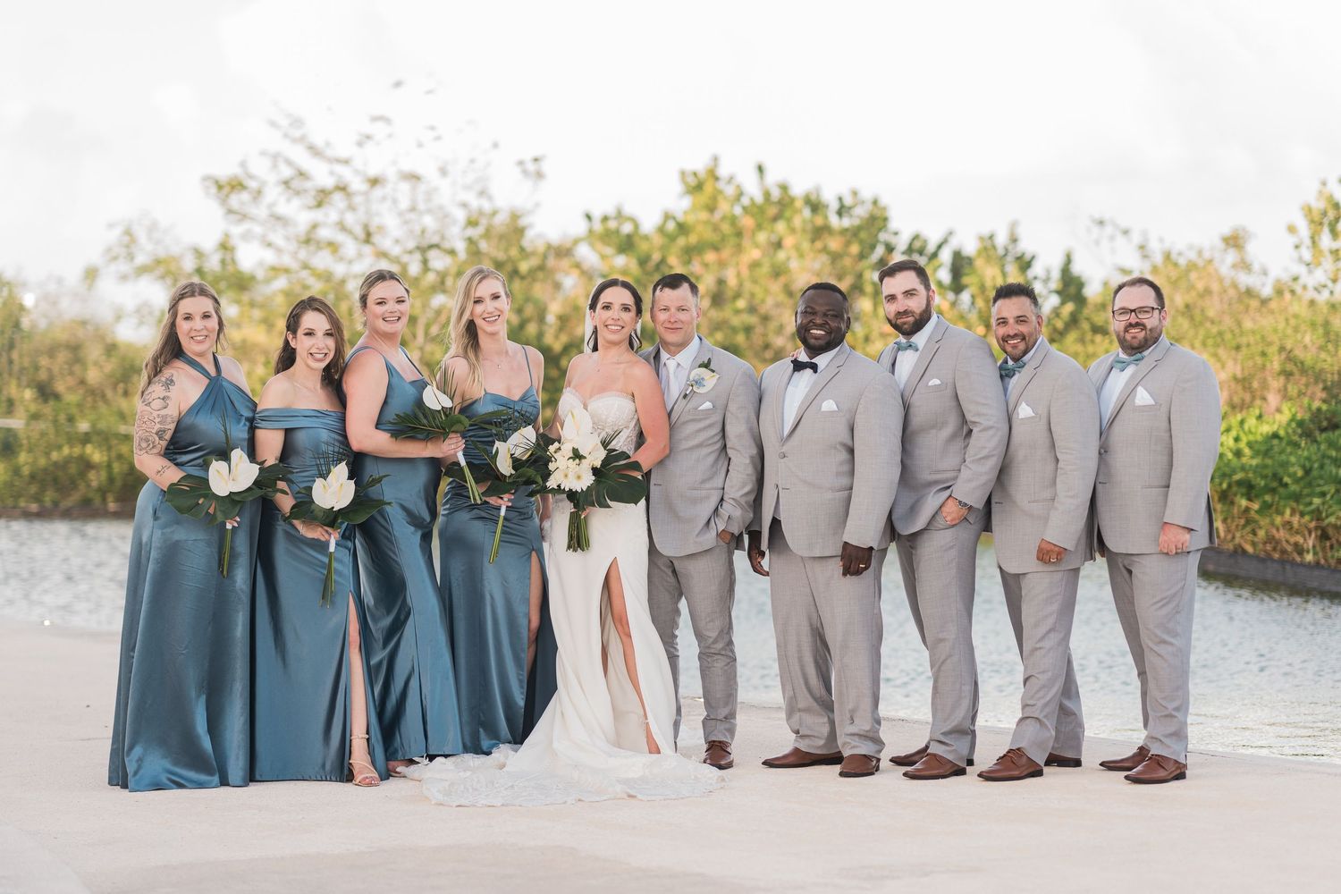 Wedding party poses outdoors at grand palladium costa mujeres wedding