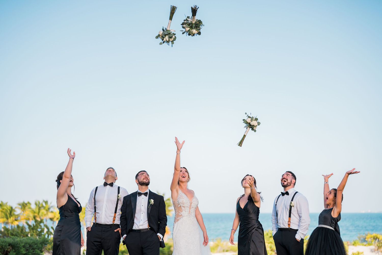 Riu palace costa mujeres wedding - bridal party photoshoot tossing bouquets