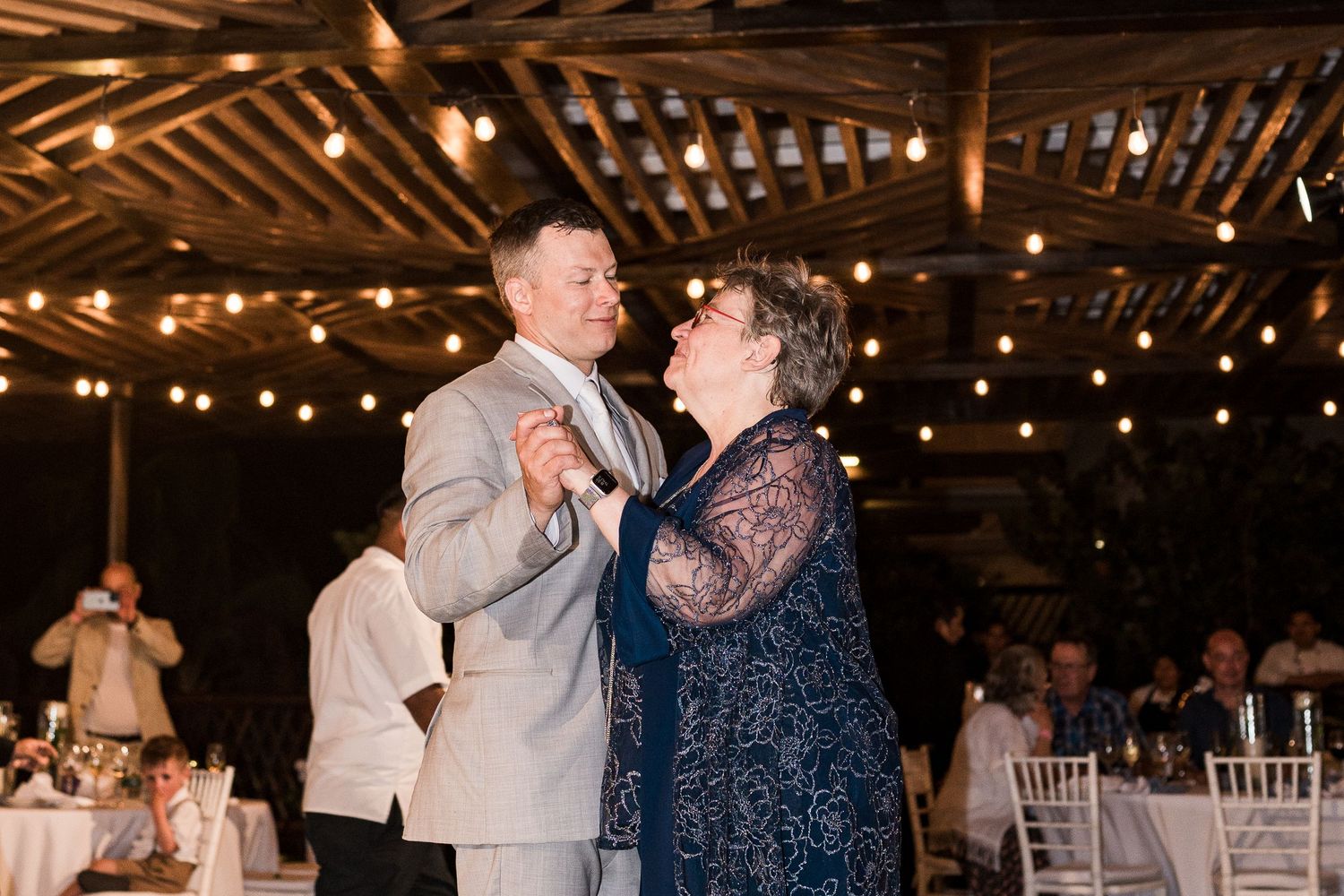 Groom dancing with mother at grand palladium costa mujeres wedding reception