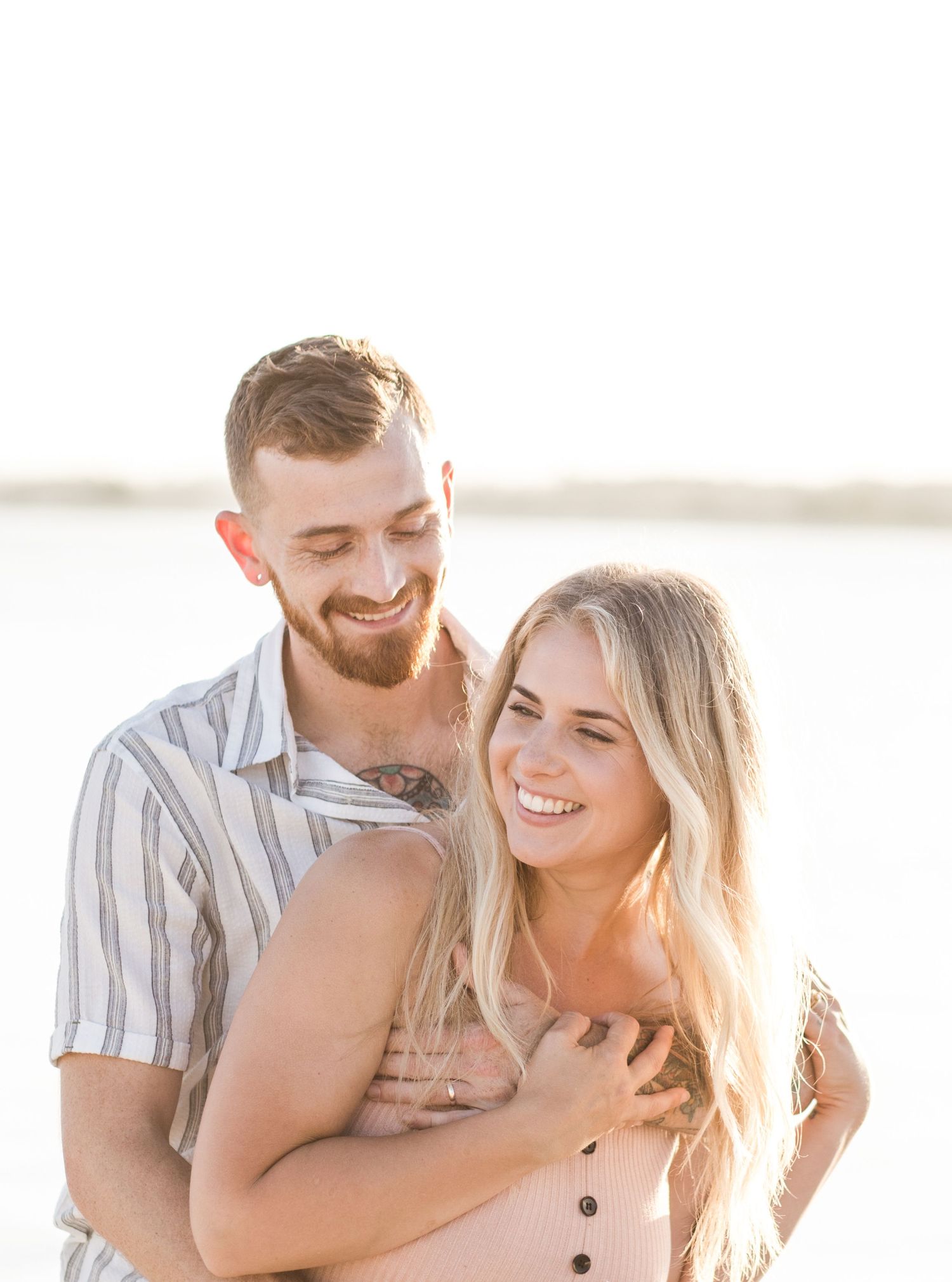 Couple at the beach at golden hour