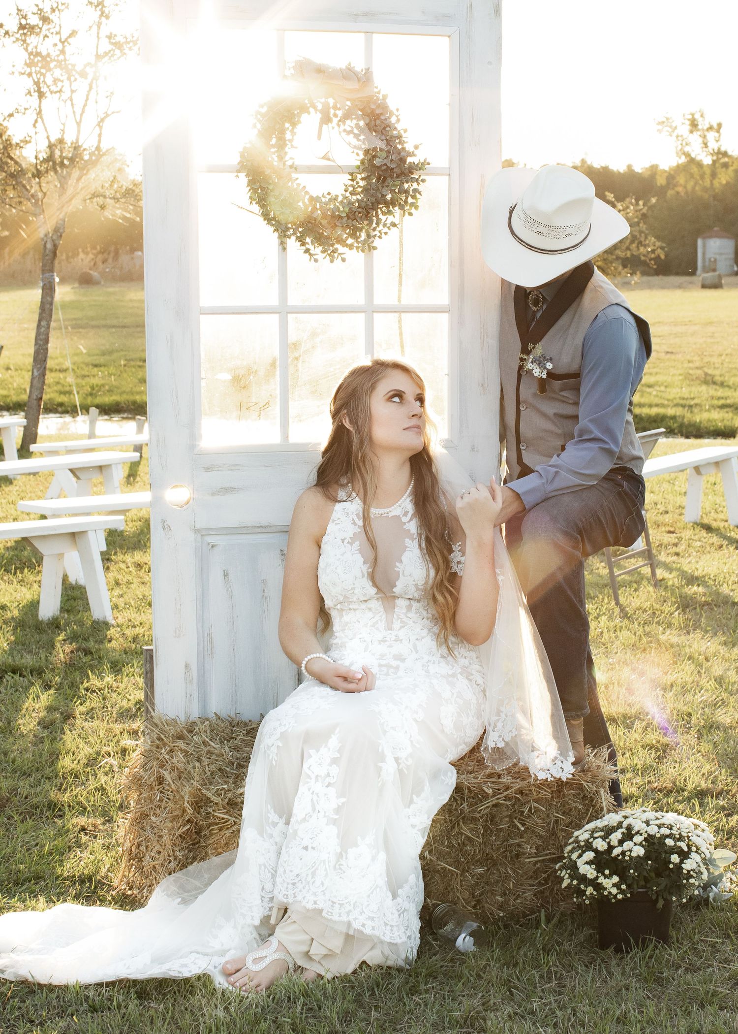 Bride and groom wedding photograph on farm at sunset