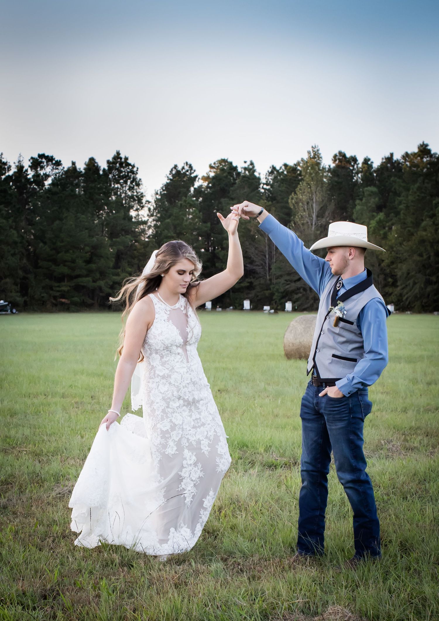 Farm wedding photograph of bride and groom dancing Brunswick County, NC