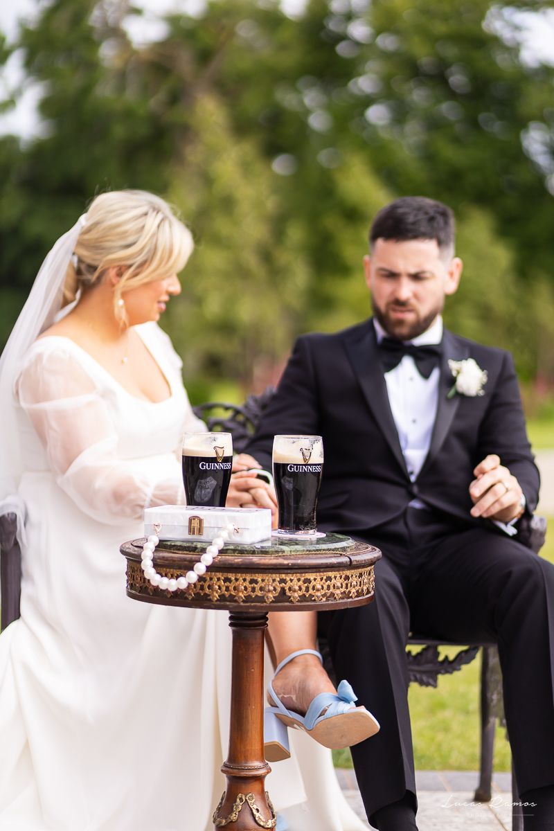 Candid welcome drinks moment with Guinness – Emily & Mike enjoying Irish charm and fun at Boyne Hill House by LR Photography.