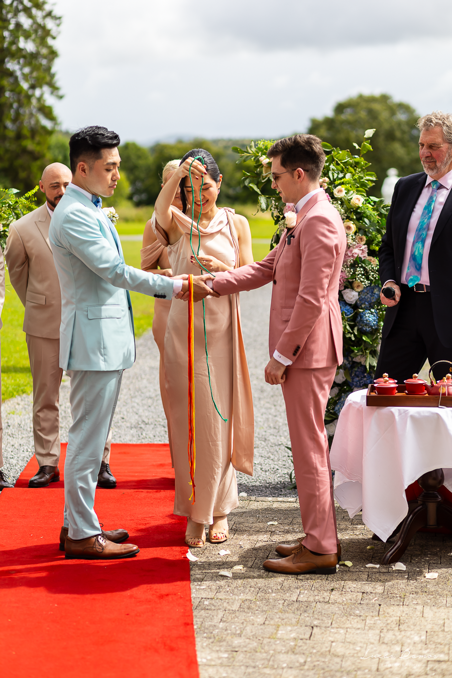 motional handfasting ceremony at Kilronan Castle — a symbolic moment of multicultural love, captured with artistic precision.