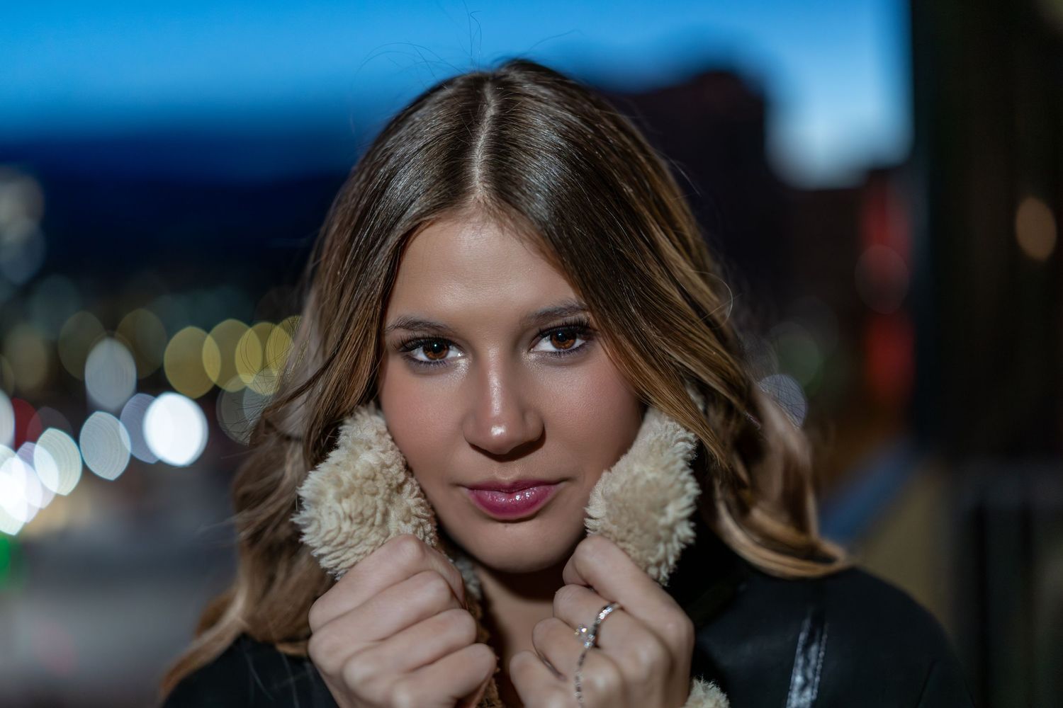 A collage of five portrait photos with bokeh lighting effects and dark backgrounds.