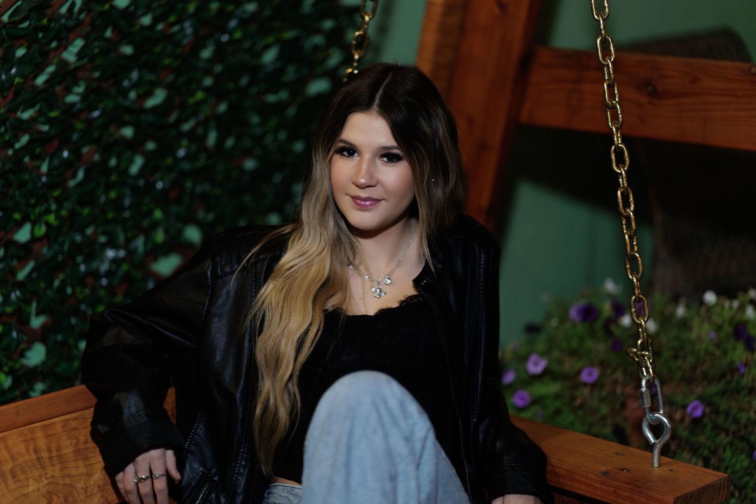 A series of outdoor portrait photos showing someone with long hair in casual attire posing against natural backgrounds.