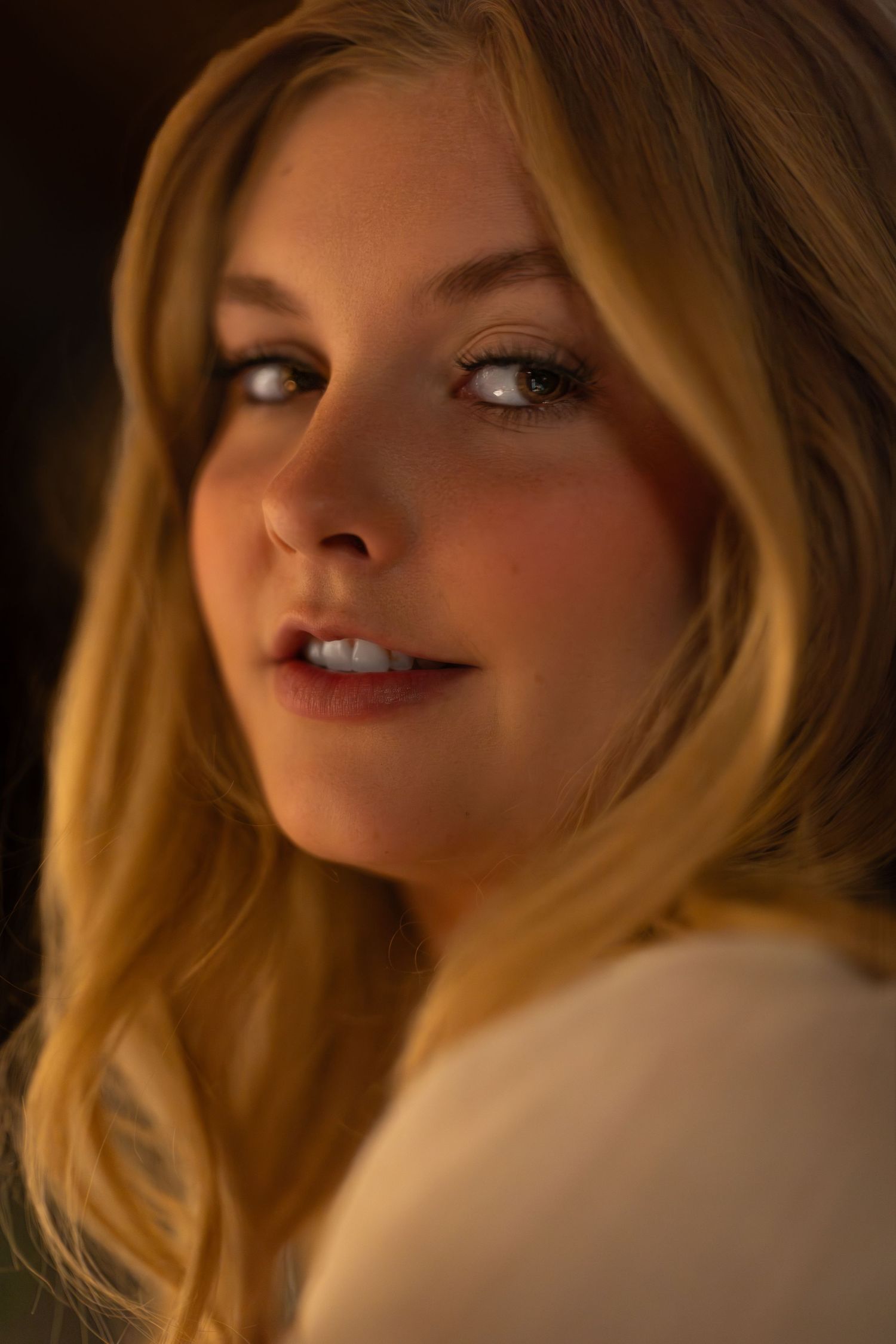 Close-up portrait shots of someone with blonde hair in warm lighting creating an intimate and artistic series.