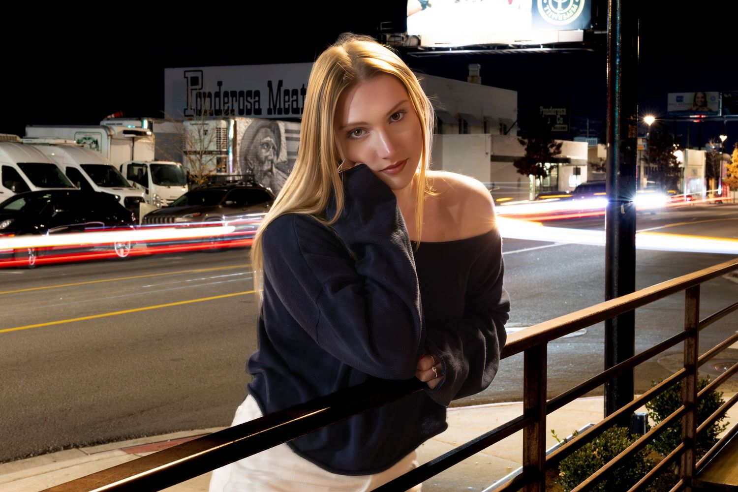 A series of moody nighttime photographs showing a figure posing against railings in an urban setting.