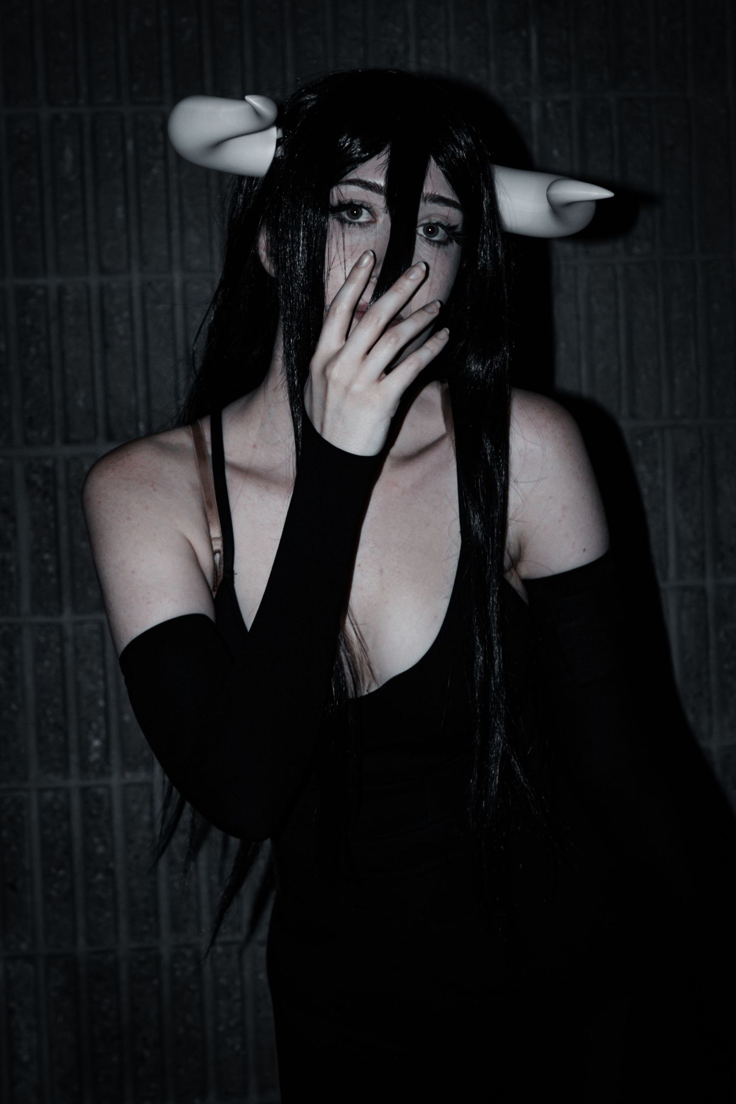 Artistic portrait series featuring gothic fashion and dramatic gestures.