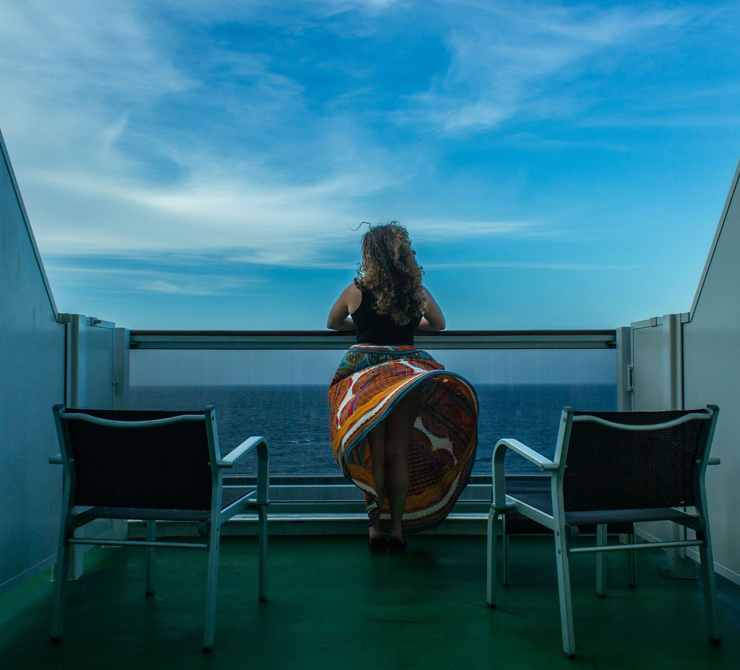 Woman enjoying her cruise room patio