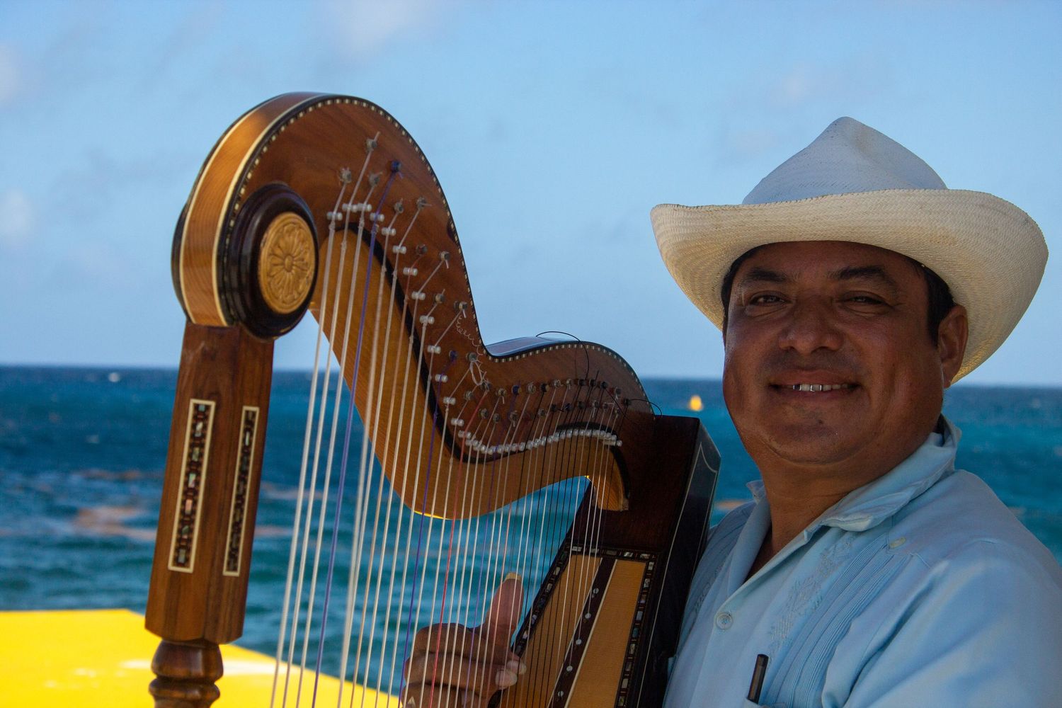 Mexican guy playing harp
