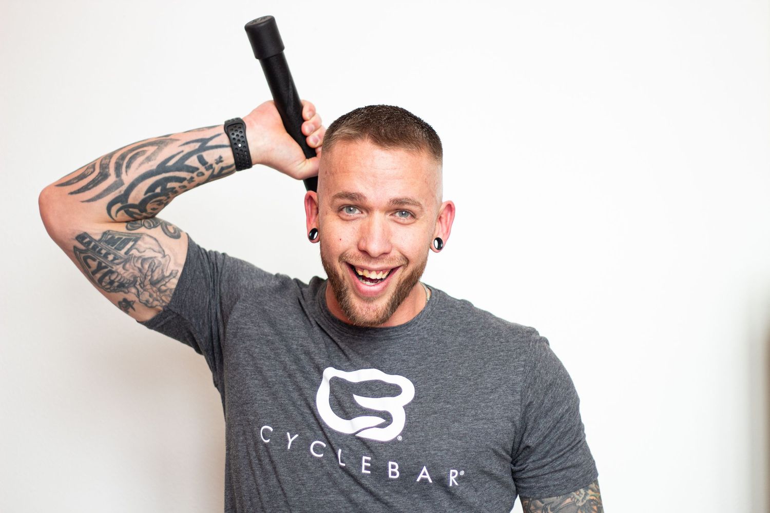 Matt Smedburg holds Cyclebar armbar behind his head during a Cyclebar DTC photoshoot