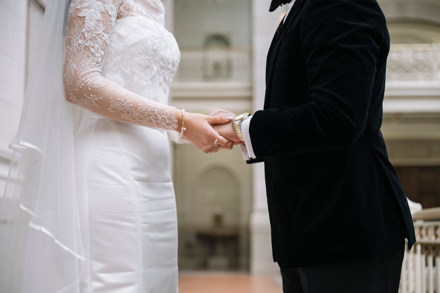 Bride and groom exchange rings during a wedding ceremony at Hartford City Hall in Hartford Connecticut. Photography by Anaise Prince.