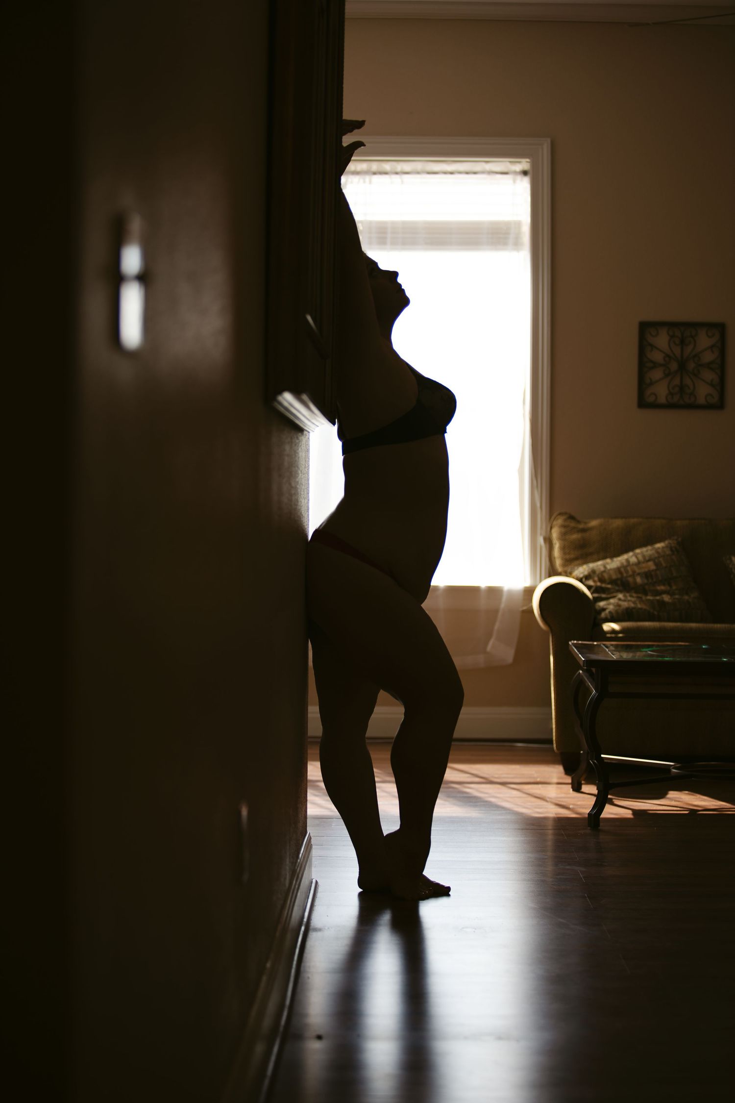 Boudoir Client in a Silhouette against the Wall