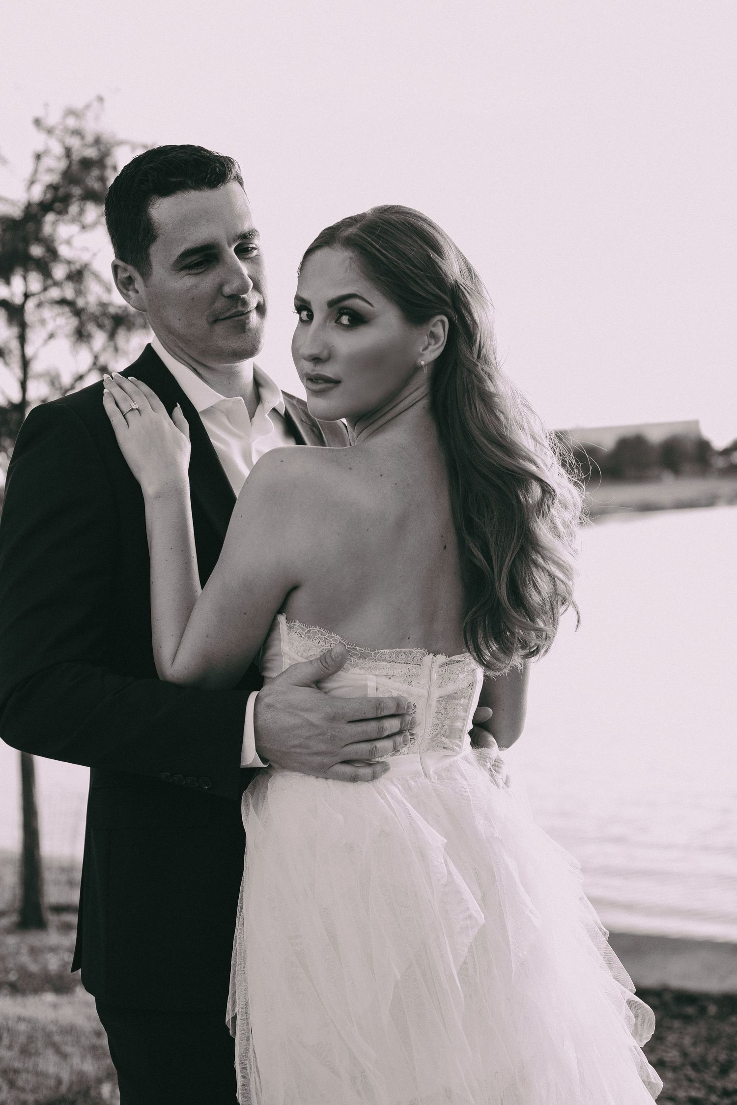 A black and white romantic portrait of a couple in formal wedding attire editorial wedding photography college station Texas.