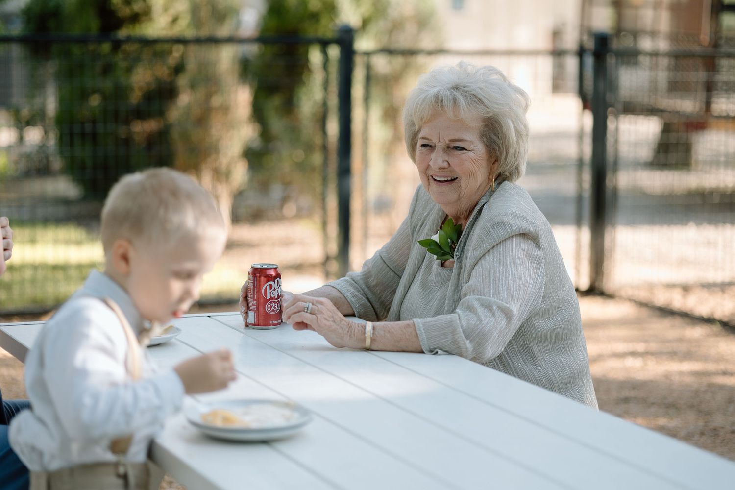 A casual outdoor scene at a picnic table with refreshments.