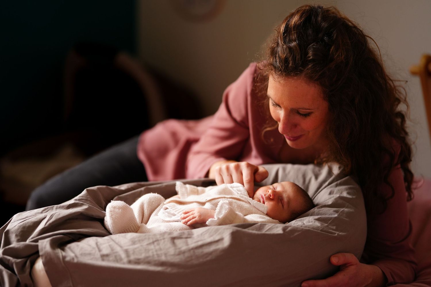 Intimate indoor portrait series with warm lighting and soft shadows.
