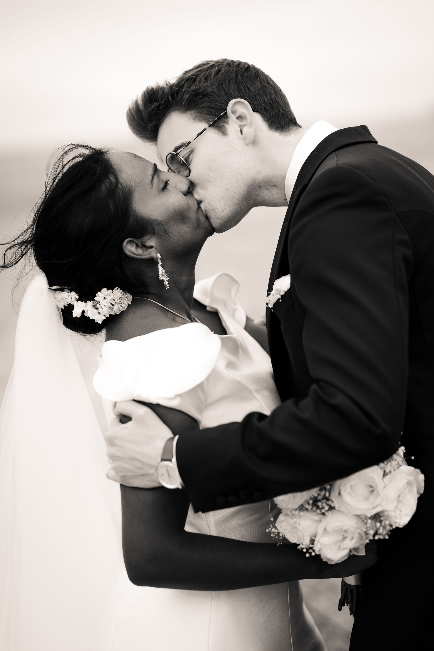 Romantic black and white wedding photography sequence showing tender embraces.