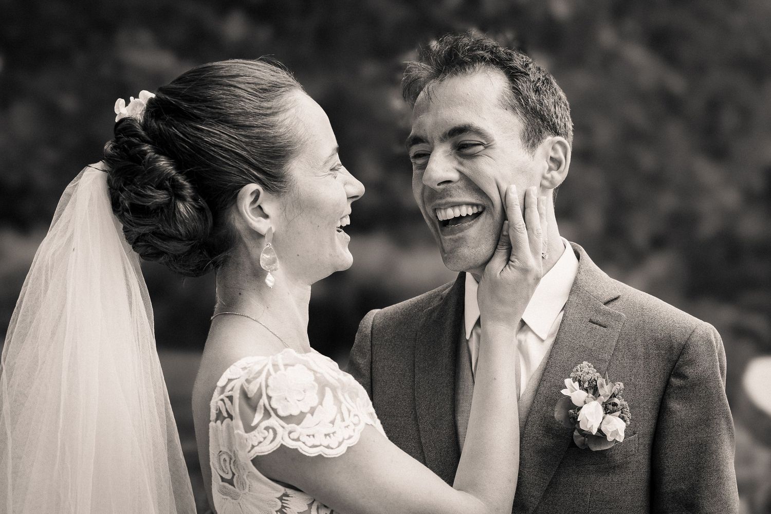 Black and white wedding portrait series showing candid moments.