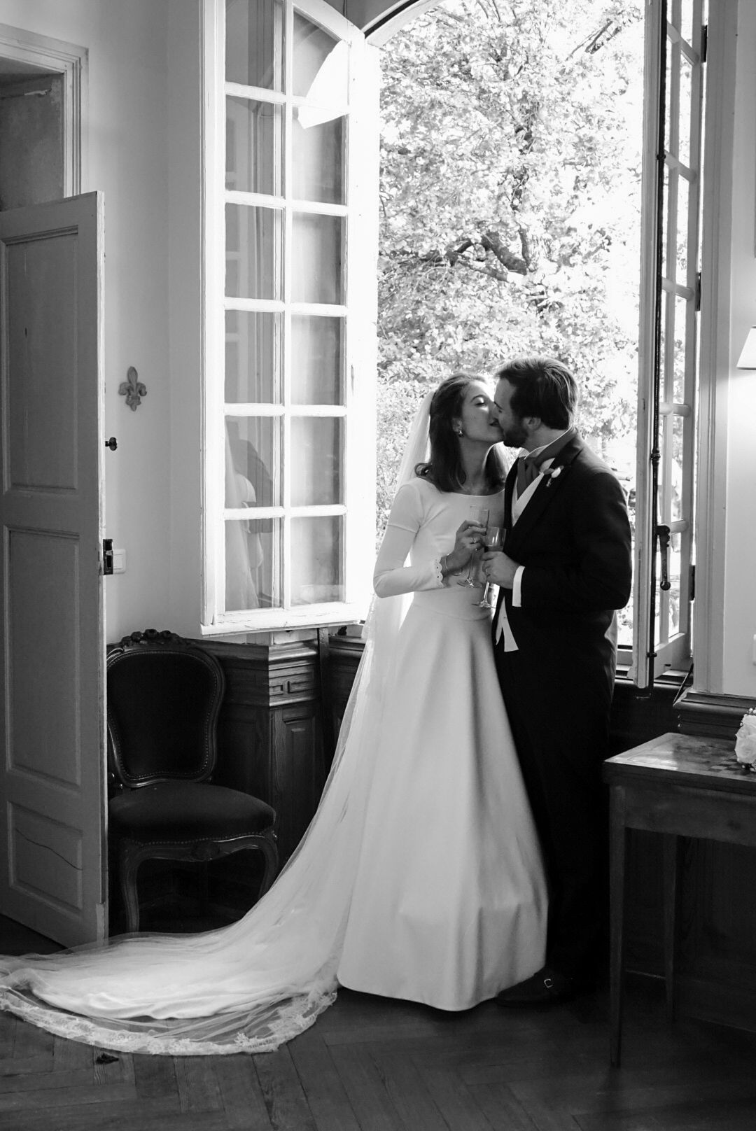 Black and white wedding sequence showing couple in elegant interior setting.