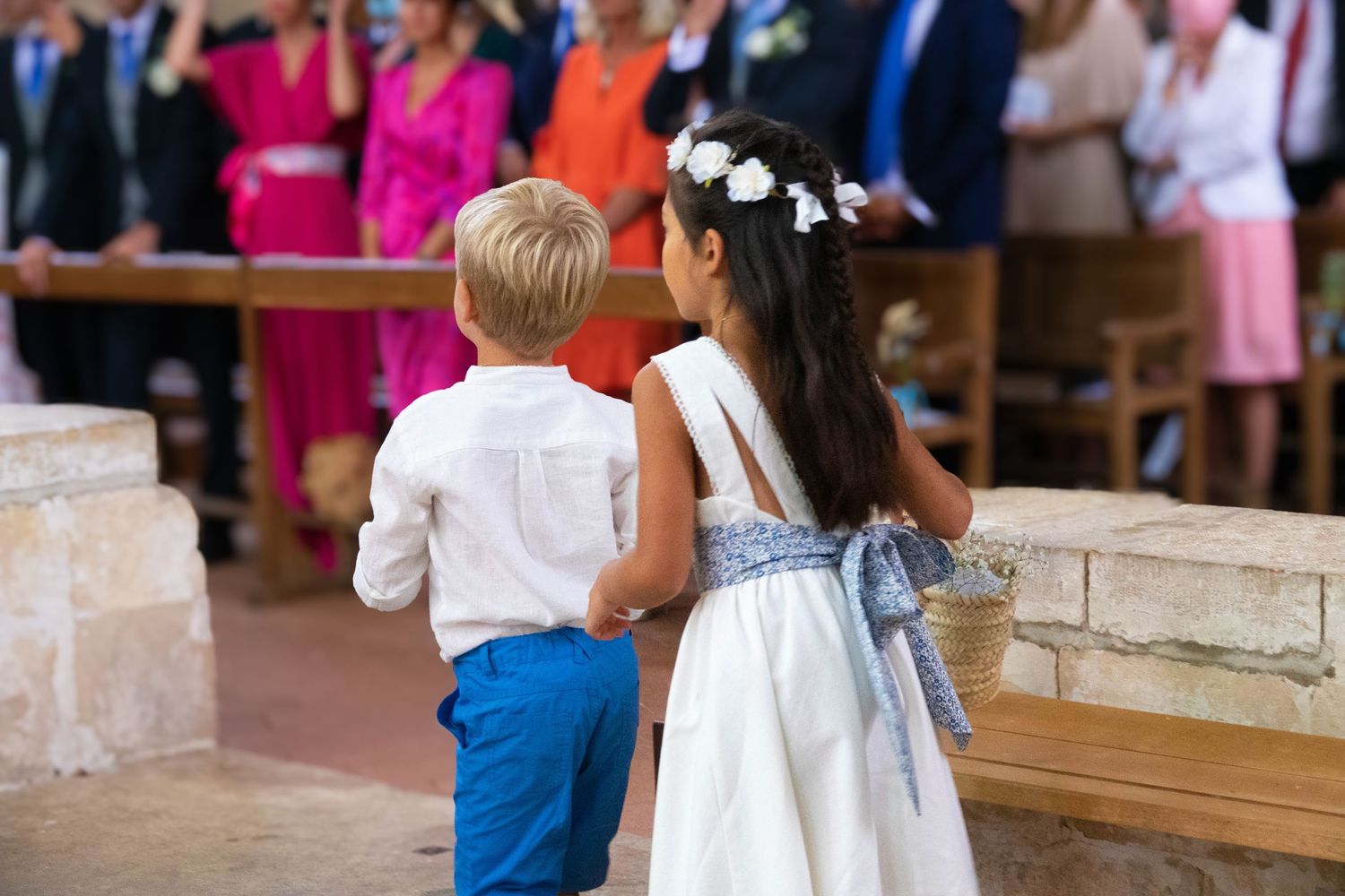 Guests seated in church pews during a traditional ceremony.