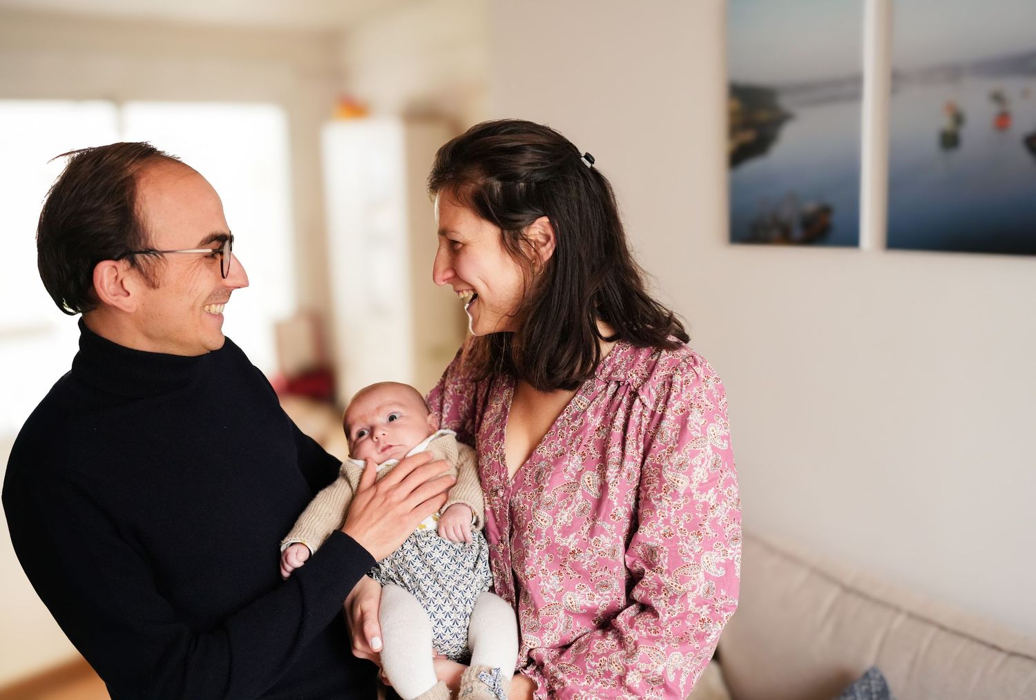 Candid family moments captured in a bright, sunlit living room.