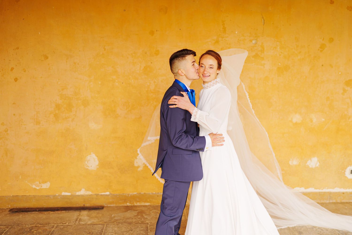 Sequence of romantic wedding photos showing couple sharing champagne toast at sunset against golden wall.