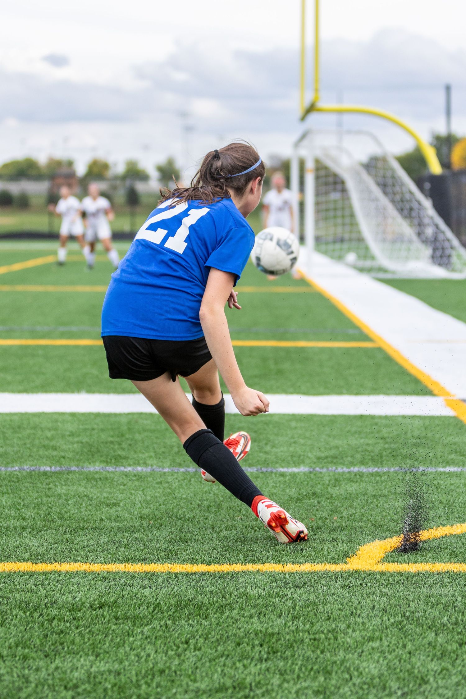 eastview high school girls soccer player kicks in from the corner