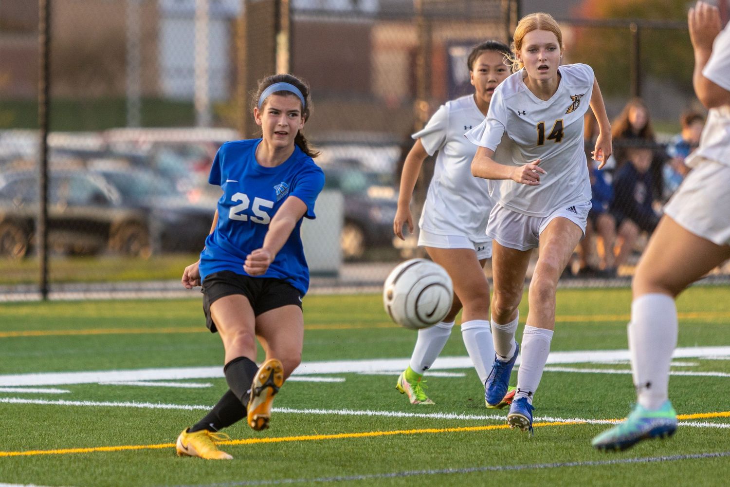 eastview high school girls soccer player centers the ball on goal to score
