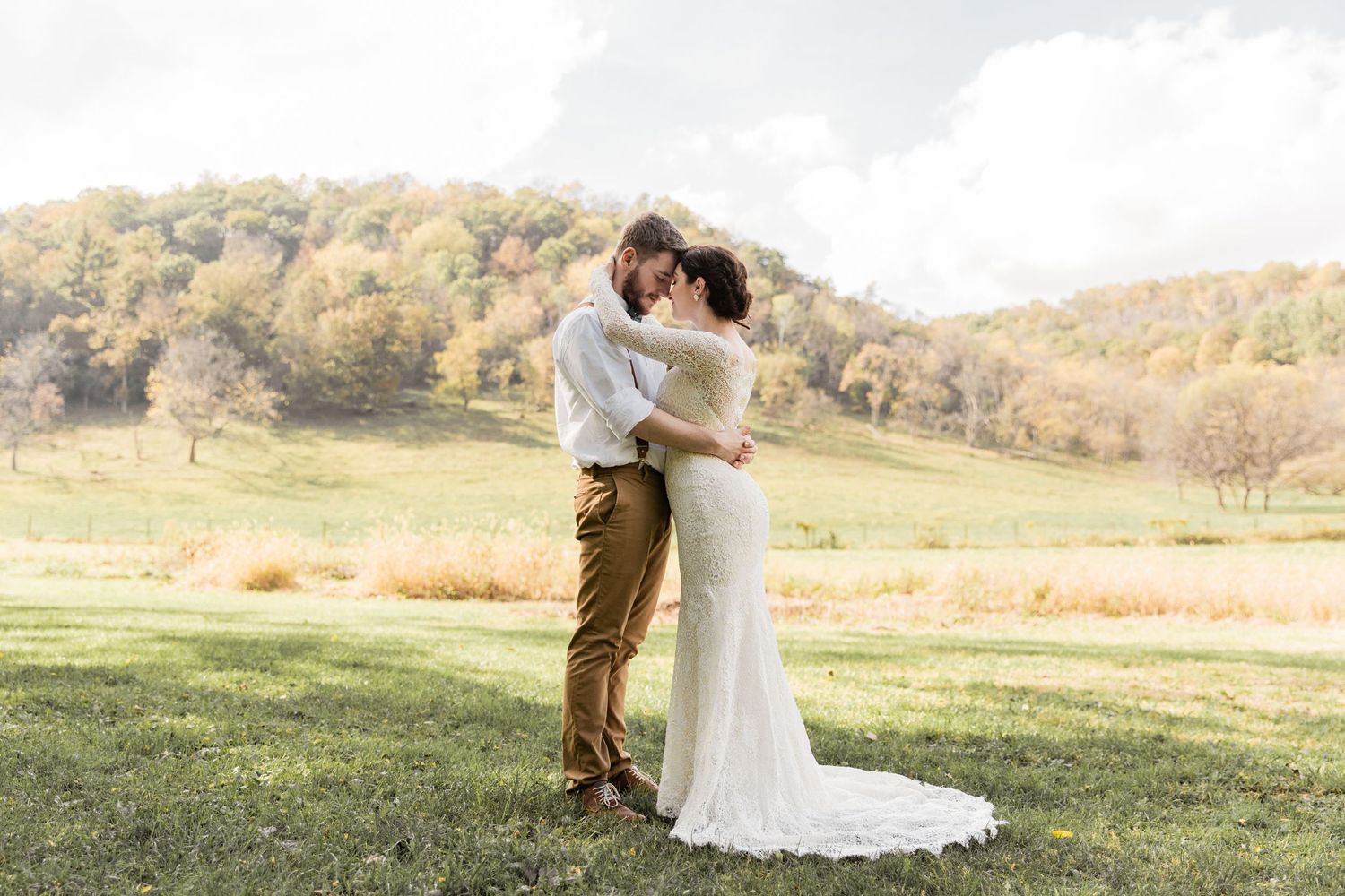 bride and groom wrap arms around each other before the I do's