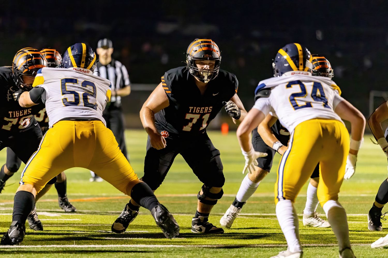 Senior center Isaac prepares to block for his quarterback