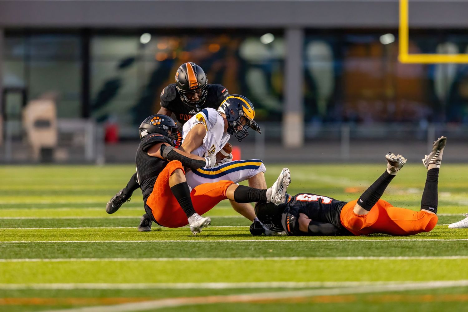 farmington tigers defenders make big tackle for loss against rosemount irish