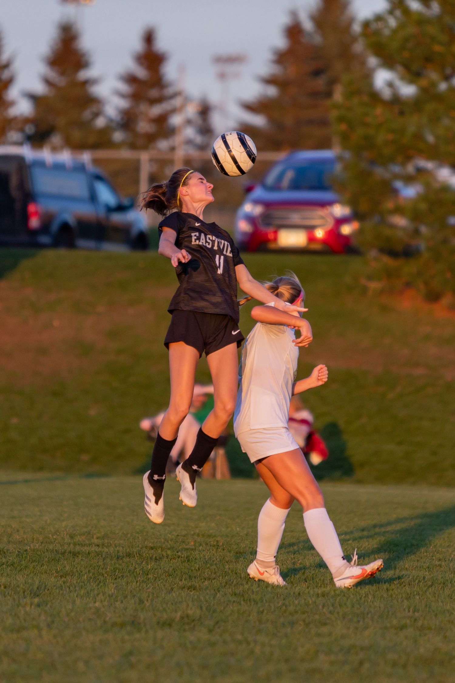 eastview high school girls soccer player jumps to head the ball