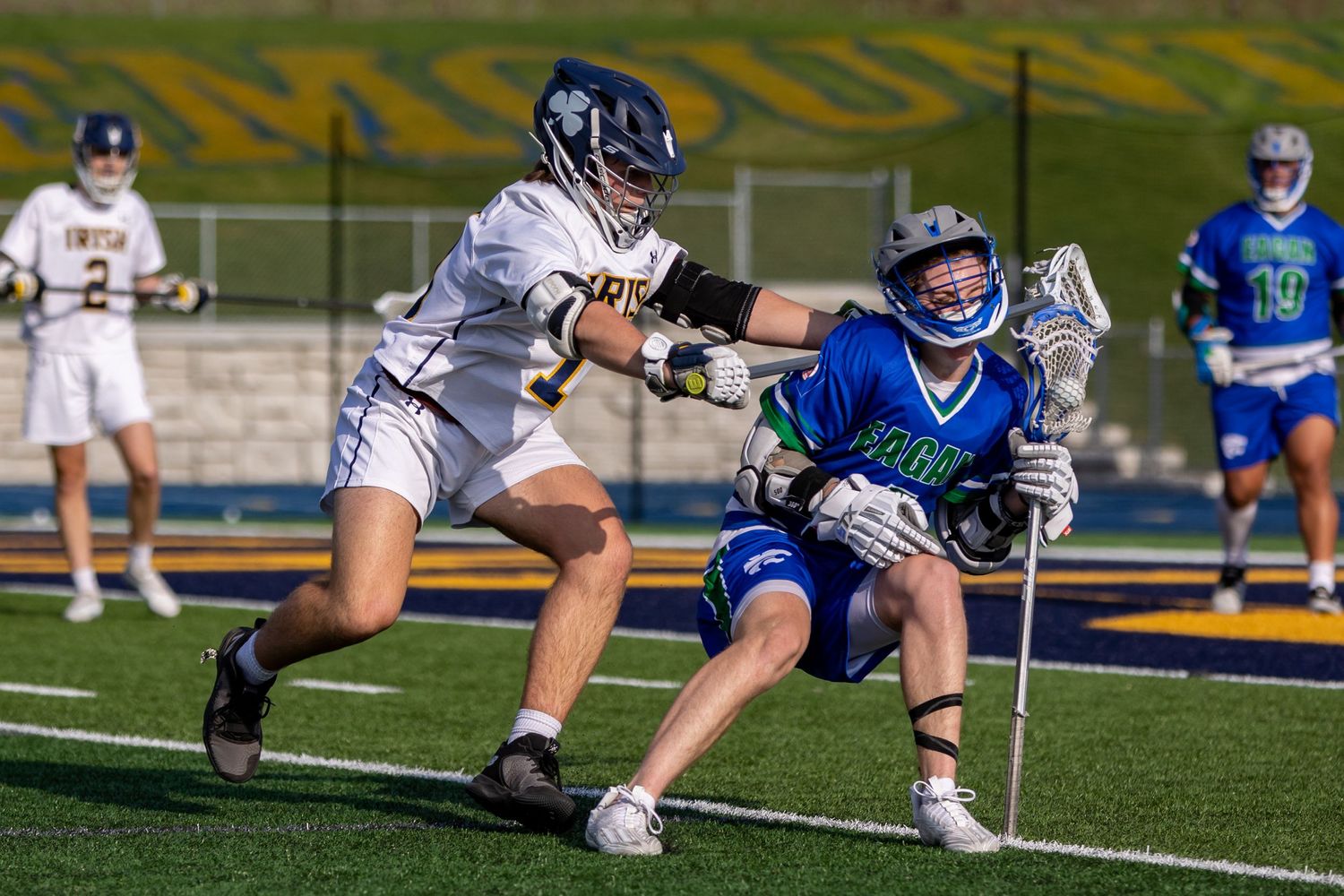rosemount irish boys lacrosse player checking jefferson player