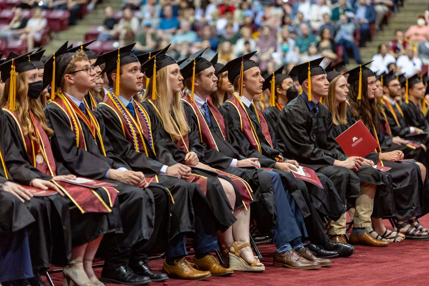 A sea of upcoming graduates for the University of Minnesota anxiously await their diplomas