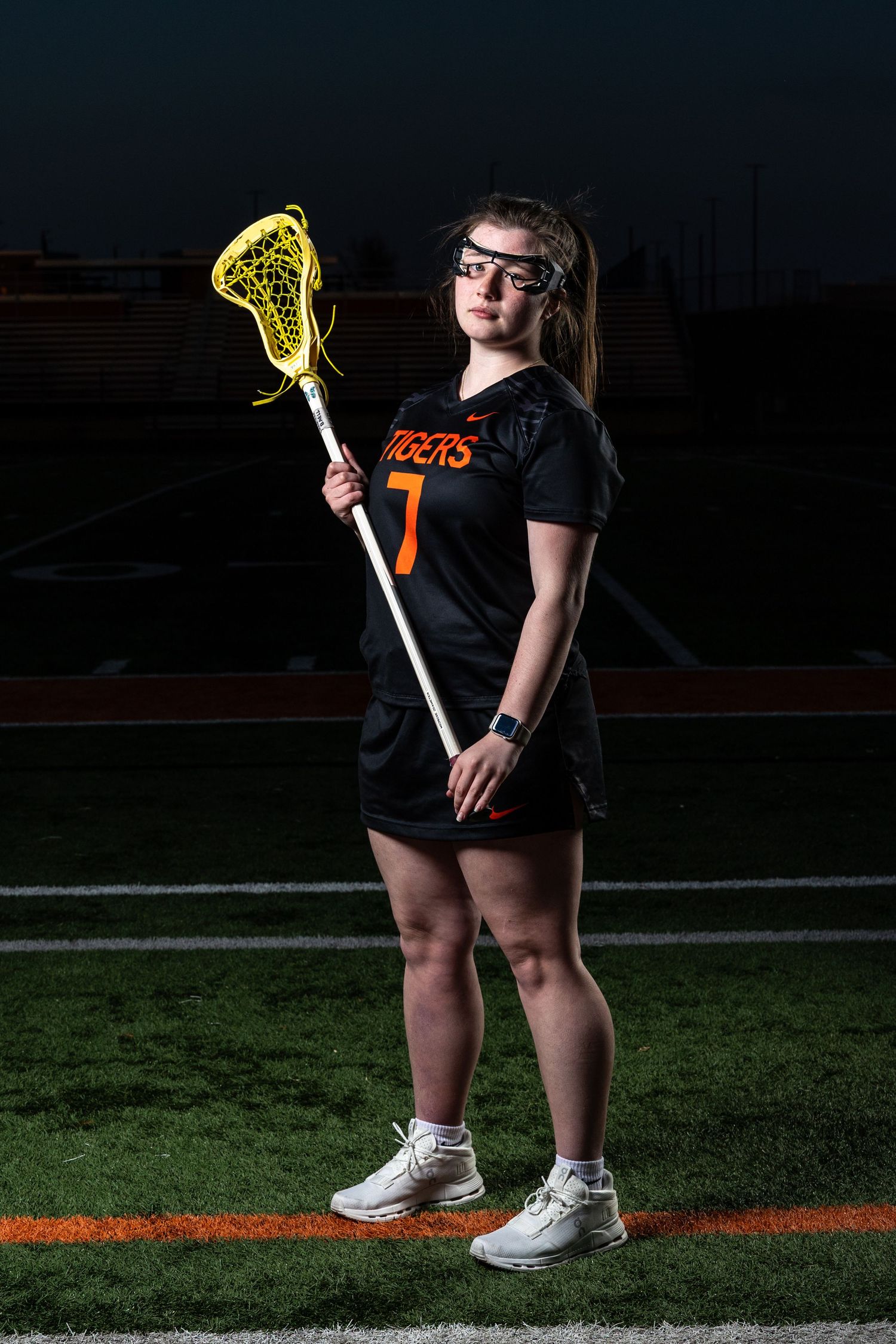 Farmington Tigers girls lacrosse player stands tall and confident for her media day pose