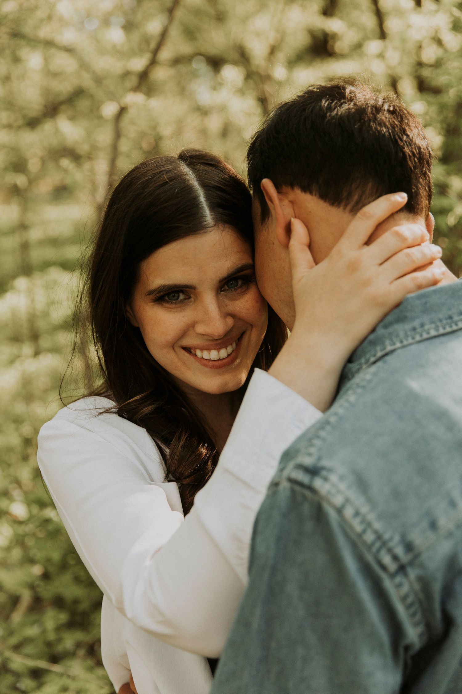 Lauren hugs her fiance Saul as she smiles directly at the camera